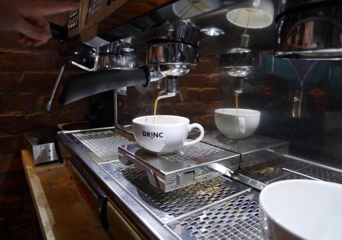 Espresso machine brewing fresh coffee at DRINC